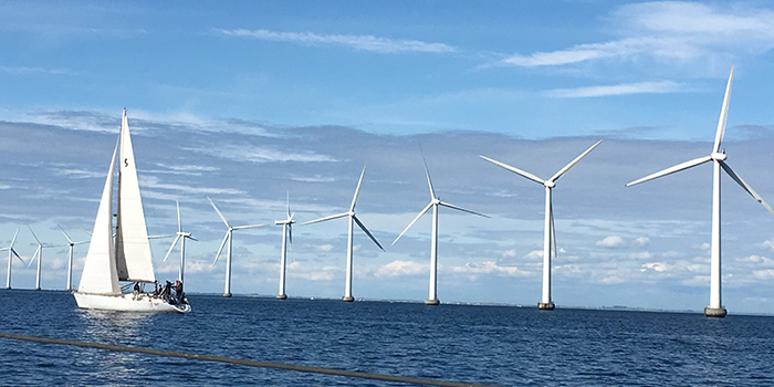 The photo is a file photo showing offshore wind turbines